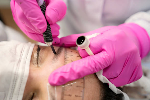 Which eyebrow shape is ideal for balancing out a heavier jaw, a round eye or pear face shape?